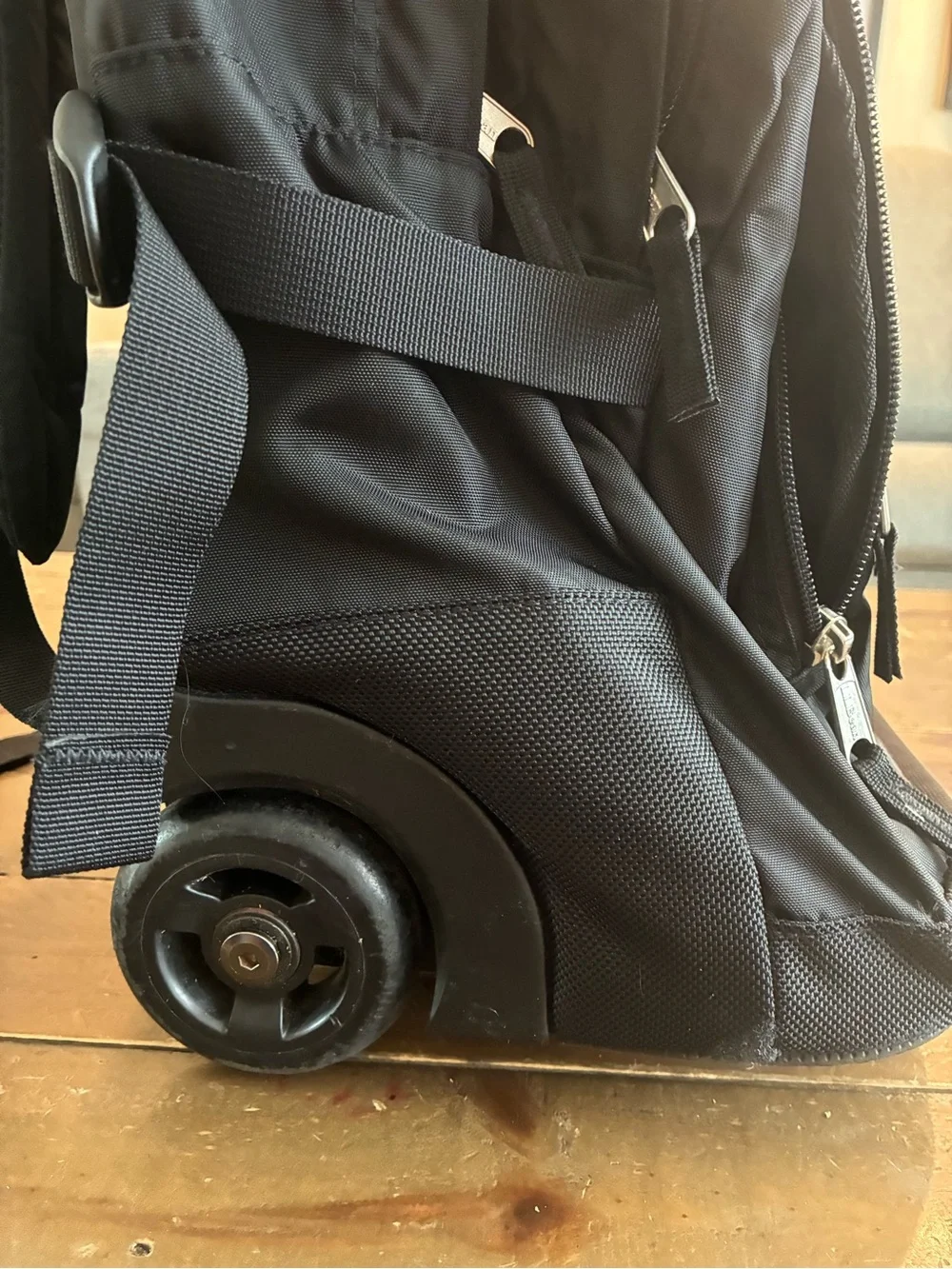 L.L. Bean Black Rolling Backpack with Silver Reflective Accent